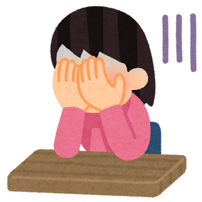 顔を抑えて落ち込んでいる女性