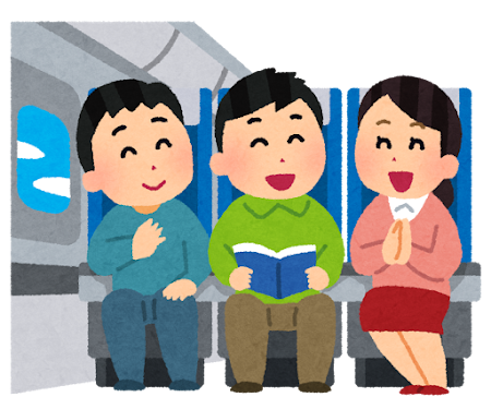 新幹線で椅子に座っている男女