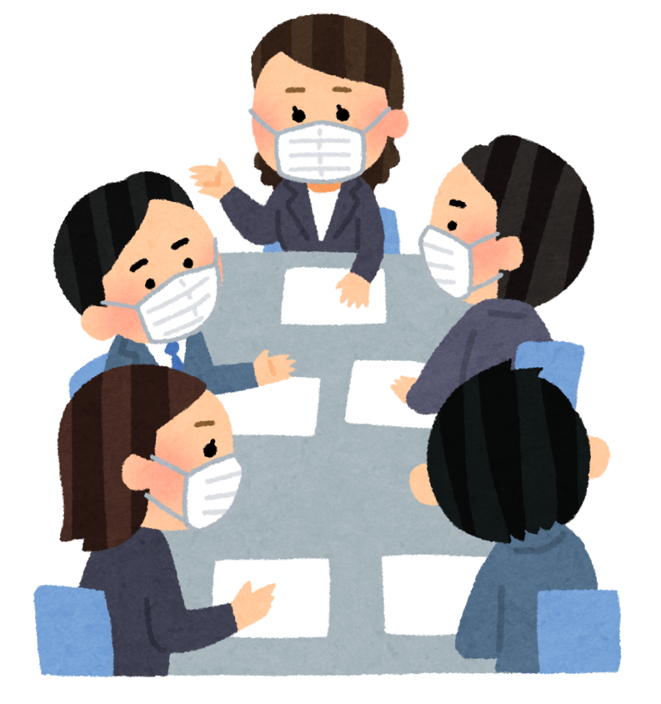 マスクをつけ会議している会社員たち